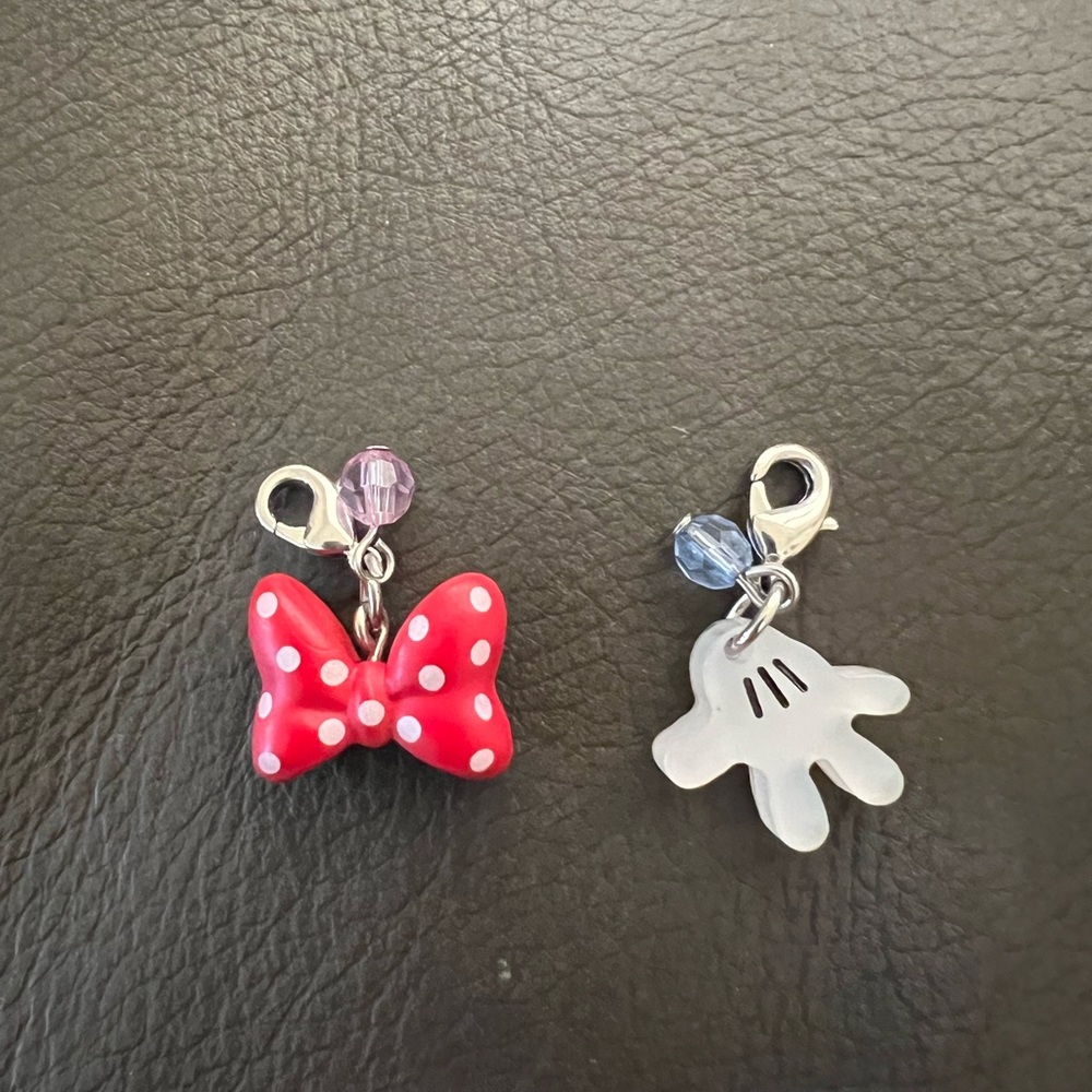 Two Disney charms:Minnie’s bow & mickeys hand
